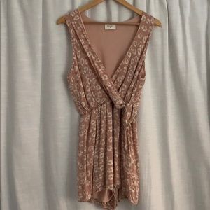 Pink, wrap-front style romper. Brand Everly.